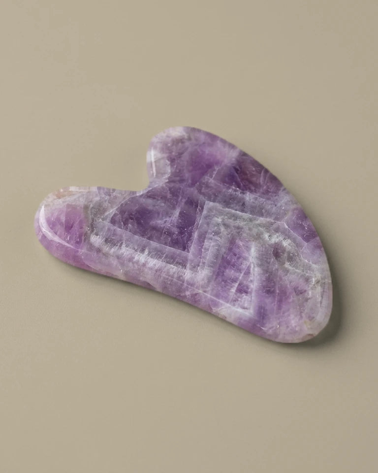 Pierre de gua sha en améthyste