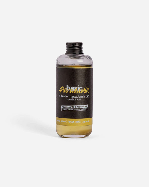 Flacon d'huile de macadamia bio Basic Cosmetics sur fond blanc