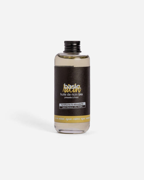 Flacon d'huile de ricin bio Basic Cosmetics sur fond blanc