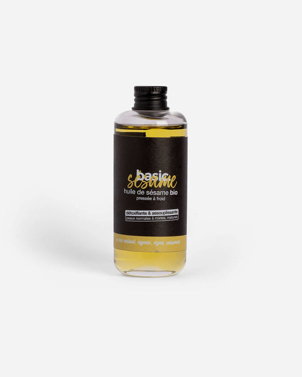 Flacon d'huile de sésame bio Basic Cosmetics sur fond blanc